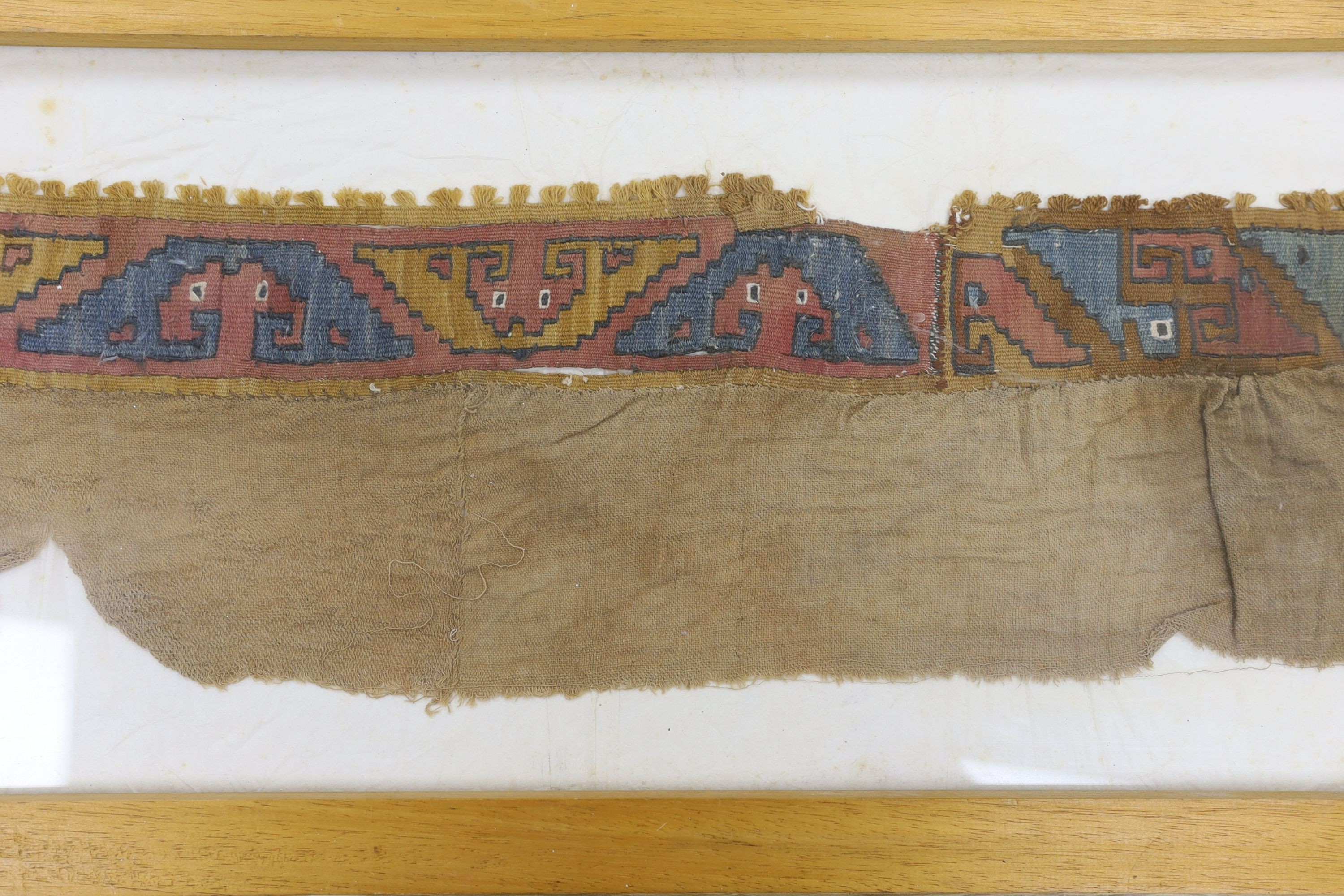 A pre-Columbian grave textile, framed